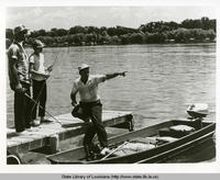 Men and boys fishing at False River in New Roads Louisiana