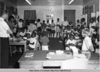 Participants in the Head Start Program visit the West Bank Branch of the Saint James Parish cemonstration library in Vacherie Louisiana in 1966