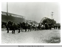 Horse drawn cart hauling large telephone cable reels for AT&T possibly in Louisiana in 1911