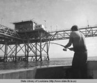 Fishing near an offshore platform near Grand Isle Louisiana in 1970