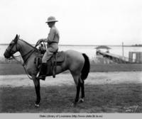Mr. Arthur L. Gayle riding near a river in Louisiana in the 1940s
