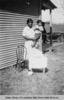 Native American mother and son celebrating his birthday in White Sulphur Springs Louisiana in the 1930s