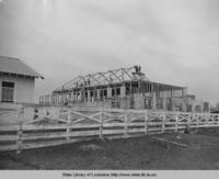Men building frame for Plaucheville Louisiana gymnasium