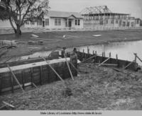 Men building Plaucheville Louisiana gymnasium and school