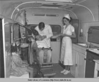 Caddo-Shreveport mobile dental service van visits a rural school in Caddo Parish in 1937