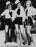 Three ladies costumed in Broadway attire in New Orleans Louisiana in the 1930s