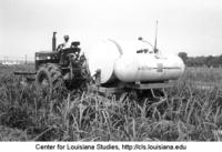 Tractor and an ammonia fertilizer machine, Poplar Grove Plantation.