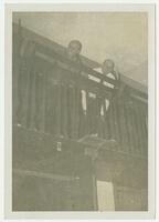 George Avakian (Columbia Records) &#38; Bill Russell (Amer. Music) peer over balcony at Artisan Hall.