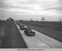 Sixth District auto caravan of inspection officials on the way to Port Allen Louisiana to inspect WPA built community center in 1936