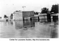 Inundated cemetery in the lower Bayou Teche region during the 1927 flood.